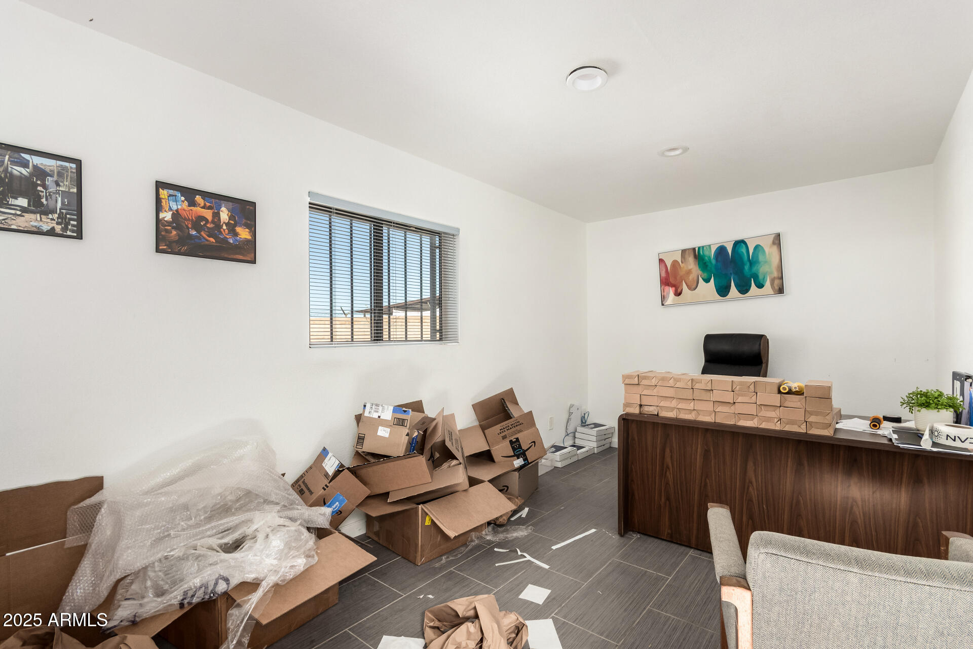 2925 East Ganley Road, Unit 121 Tucson, AZ 85706 - Photo 38 of 45 a work room with furniture and a wooden floor