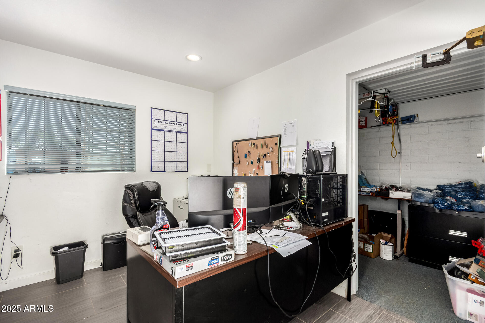 2925 East Ganley Road, Unit 121 Tucson, AZ 85706 - Photo 39 of 45 a view of a workspace with furniture and a window