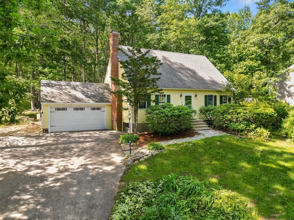 31 Kimball Road Amesbury, MA 01913 - Photo 3 of 40 a front view of a house with a yard and garage