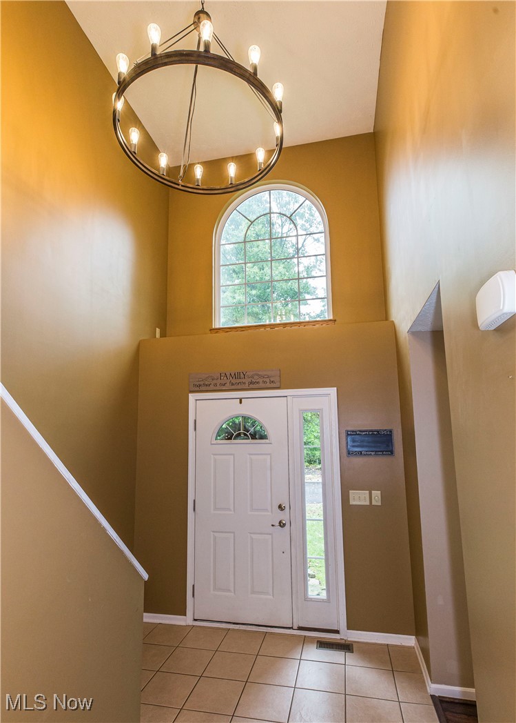 16727 Galehouse Road Doylestown, OH 44230 - Photo 3 of 38 Foyer with a towering ceiling and tile patterned floors