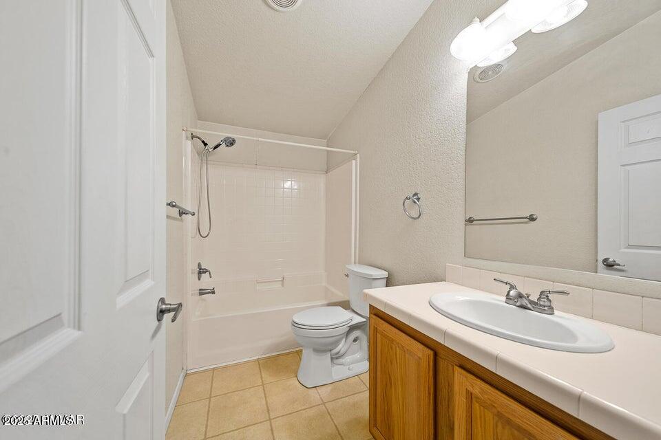 2421 West Thornton Road Show Low, AZ 85901 - Photo 30 of 48 a bathroom with a granite countertop sink toilet and shower