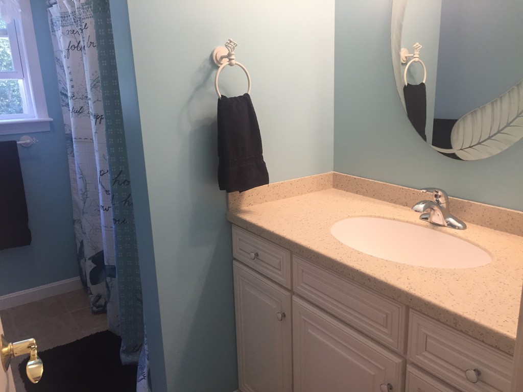 449 Mashapaug Road Holland, MA 01521 - Photo 19 of 30 a bathroom with a sink and a mirror