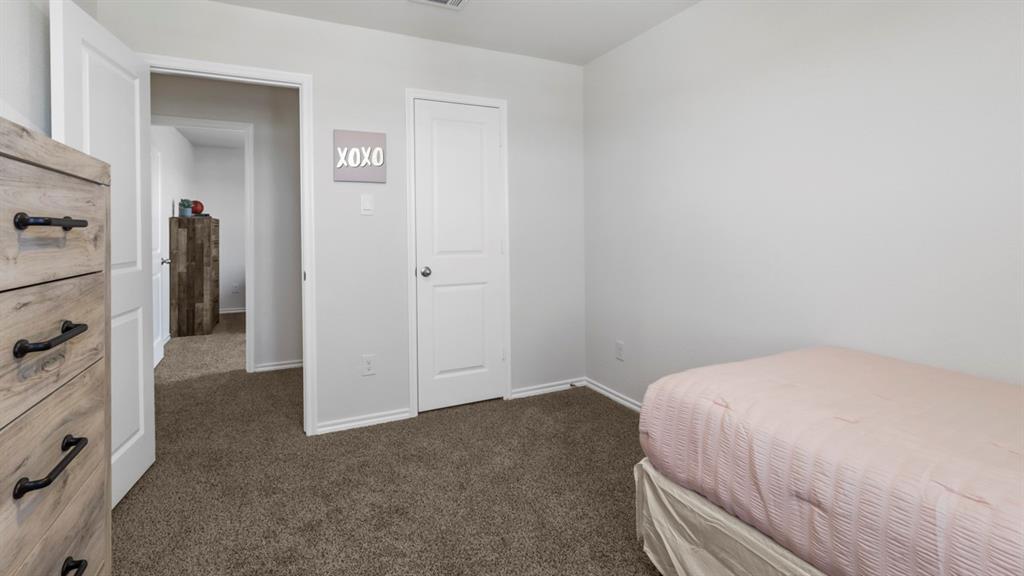 636 Dunham Road Nevada, TX 75173 - Photo 8 of 31 Bright interior room featuring neutral-toned carpet, white walls, and white trim