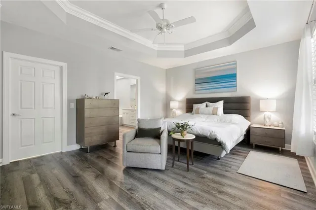 a bedroom with a bed and a couch