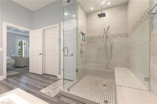 a bathroom with a shower and a toilet