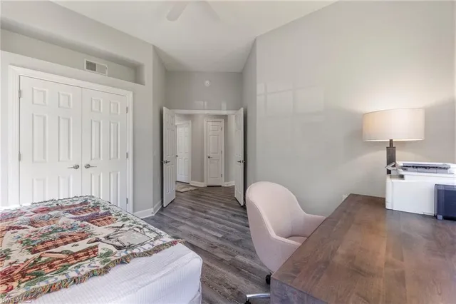 a bedroom with a bed and a chair