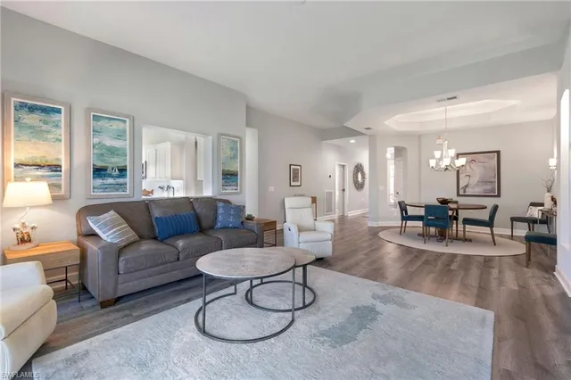 a living room with furniture and a table