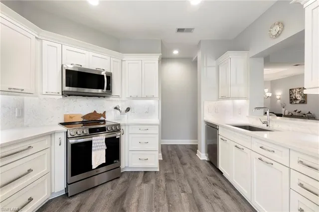 a kitchen with a stove and a sink