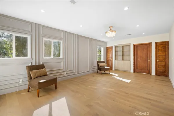 a view of a patio with wooden floor and door
