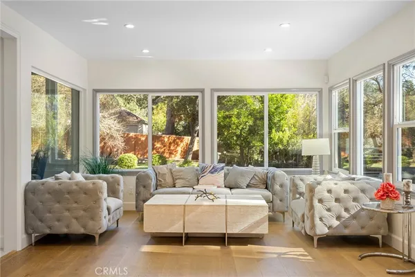 a living room with furniture and windows