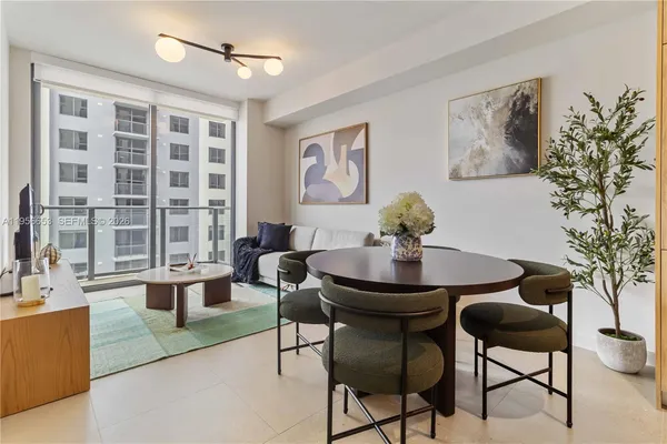 a view of a livingroom with furniture and a potted plant