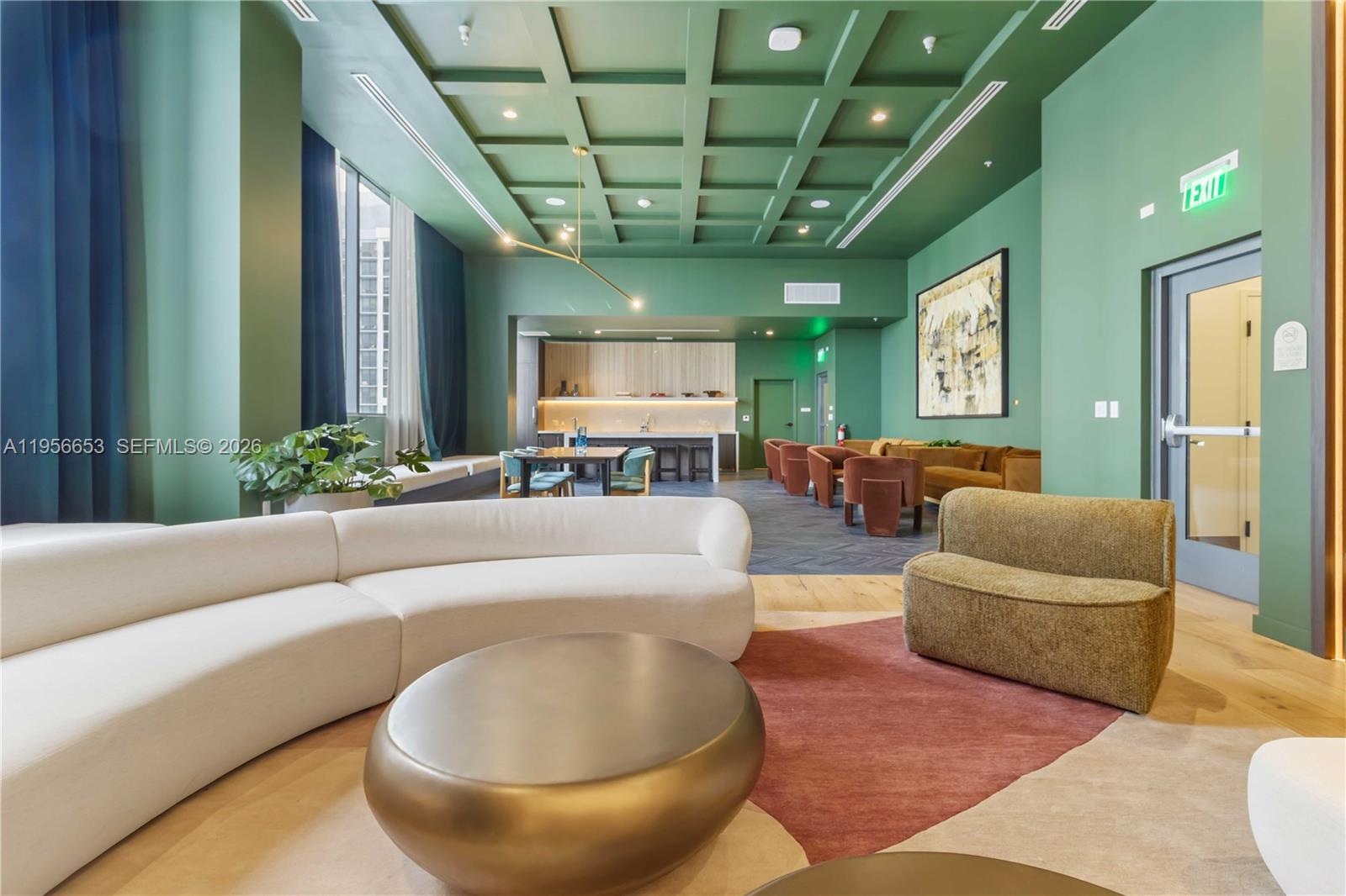 11 Northeast 6th Street, Unit 1513 Miami, FL 33132 - Photo 13 of 44 a living room with furniture and a chandelier