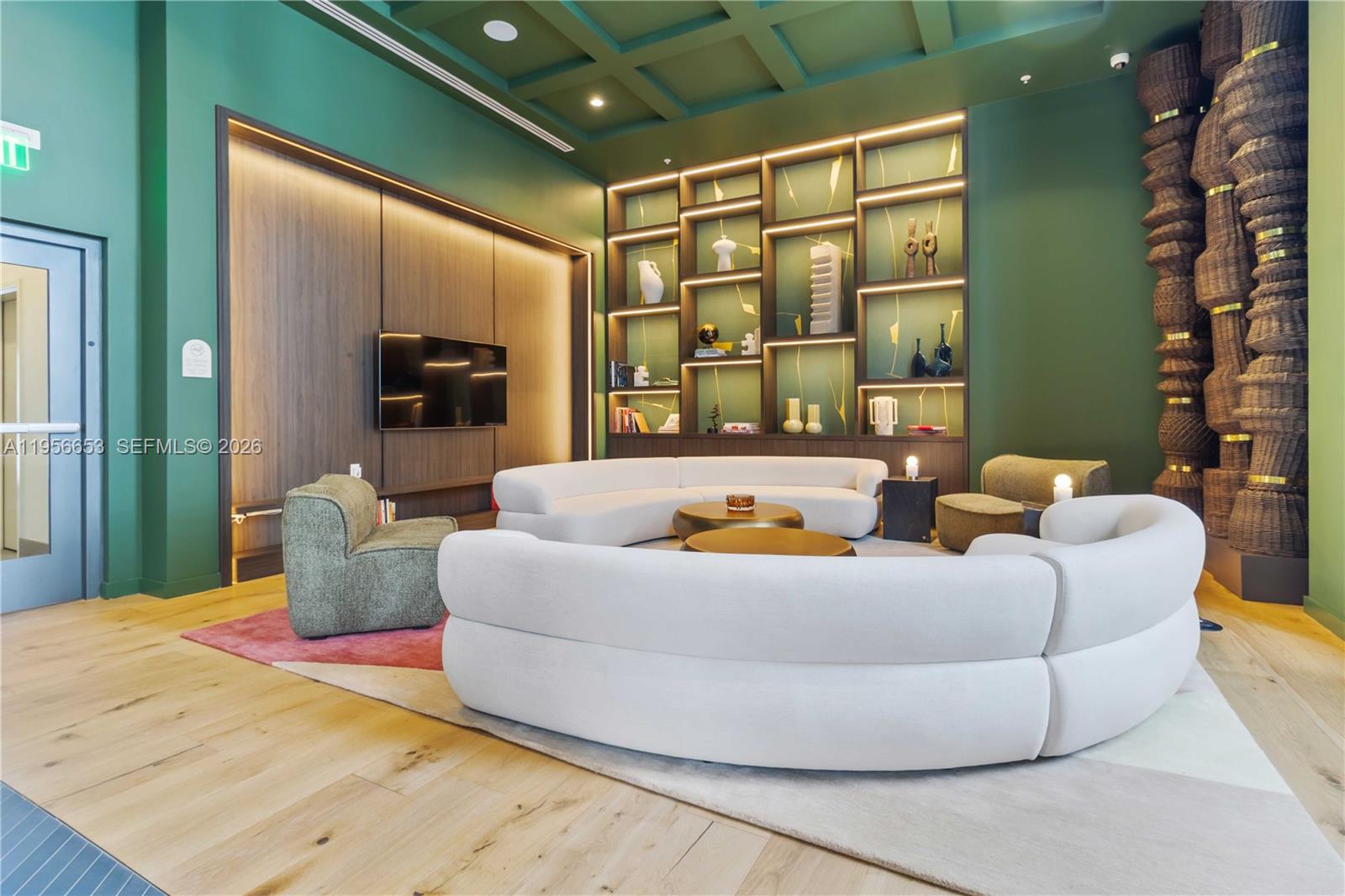 11 Northeast 6th Street, Unit 1513 Miami, FL 33132 - Photo 15 of 44 a living room with furniture and a flat screen tv