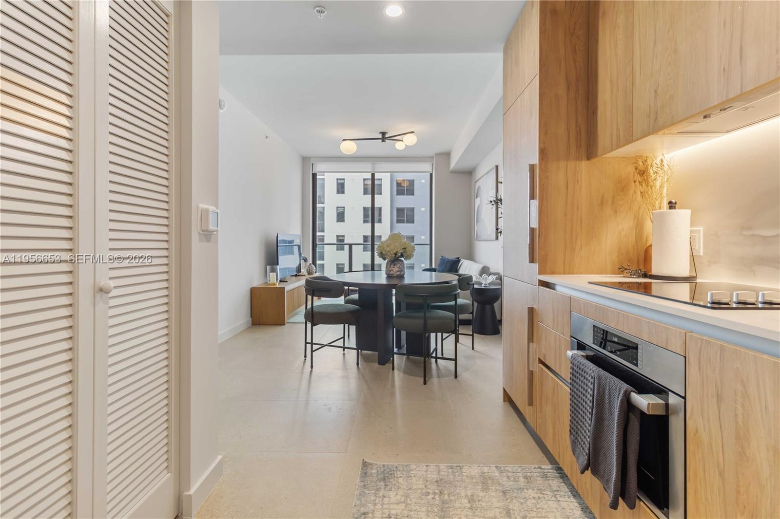 11 Northeast 6th Street, Unit 1513 Miami, FL 33132 - Photo 2 of 44 a view of a dining room with furniture