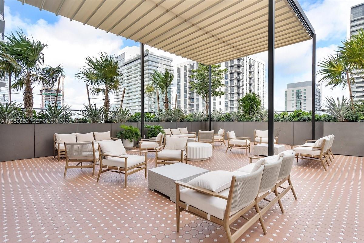 11 Northeast 6th Street, Unit 1513 Miami, FL 33132 - Photo 30 of 44 a view of swimming pool with outdoor seating and city view