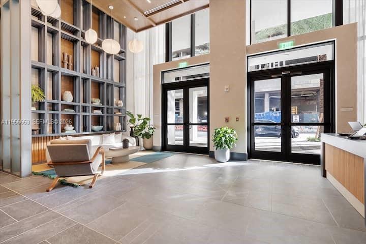 11 Northeast 6th Street, Unit 1513 Miami, FL 33132 - Photo 33 of 44 a view of front door of building with outdoor seating space