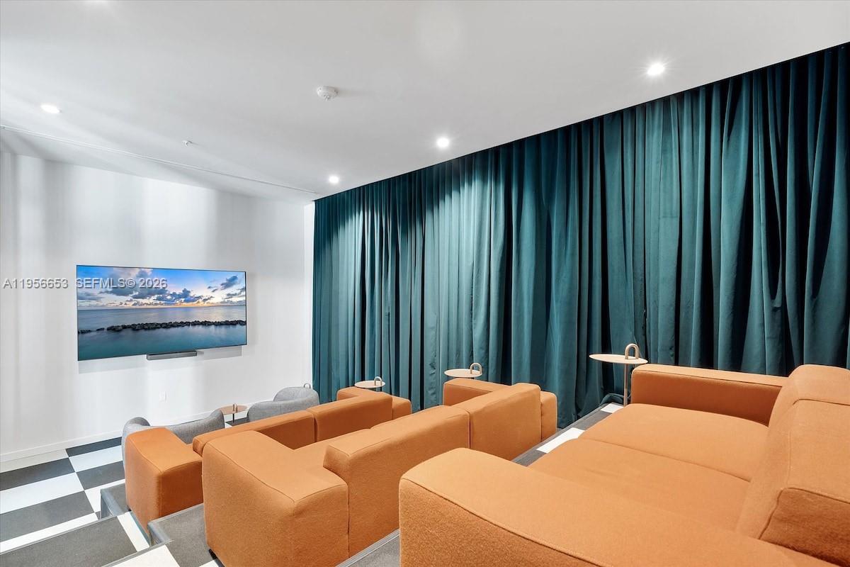 11 Northeast 6th Street, Unit 1513 Miami, FL 33132 - Photo 34 of 44 a bedroom with furniture and a painting on the wall