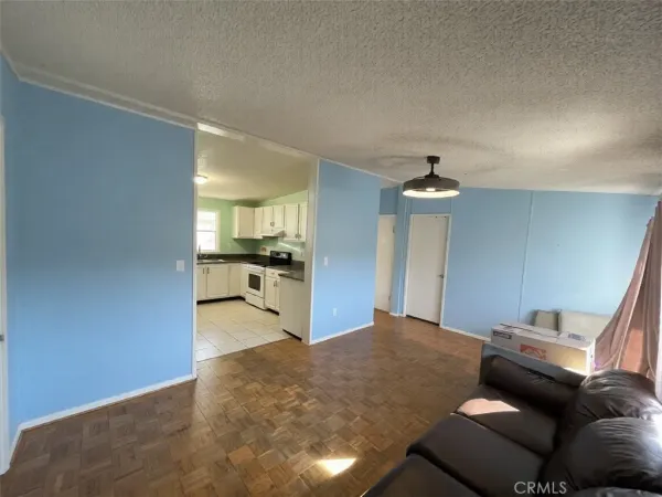 a bedroom with furniture and a chandelier