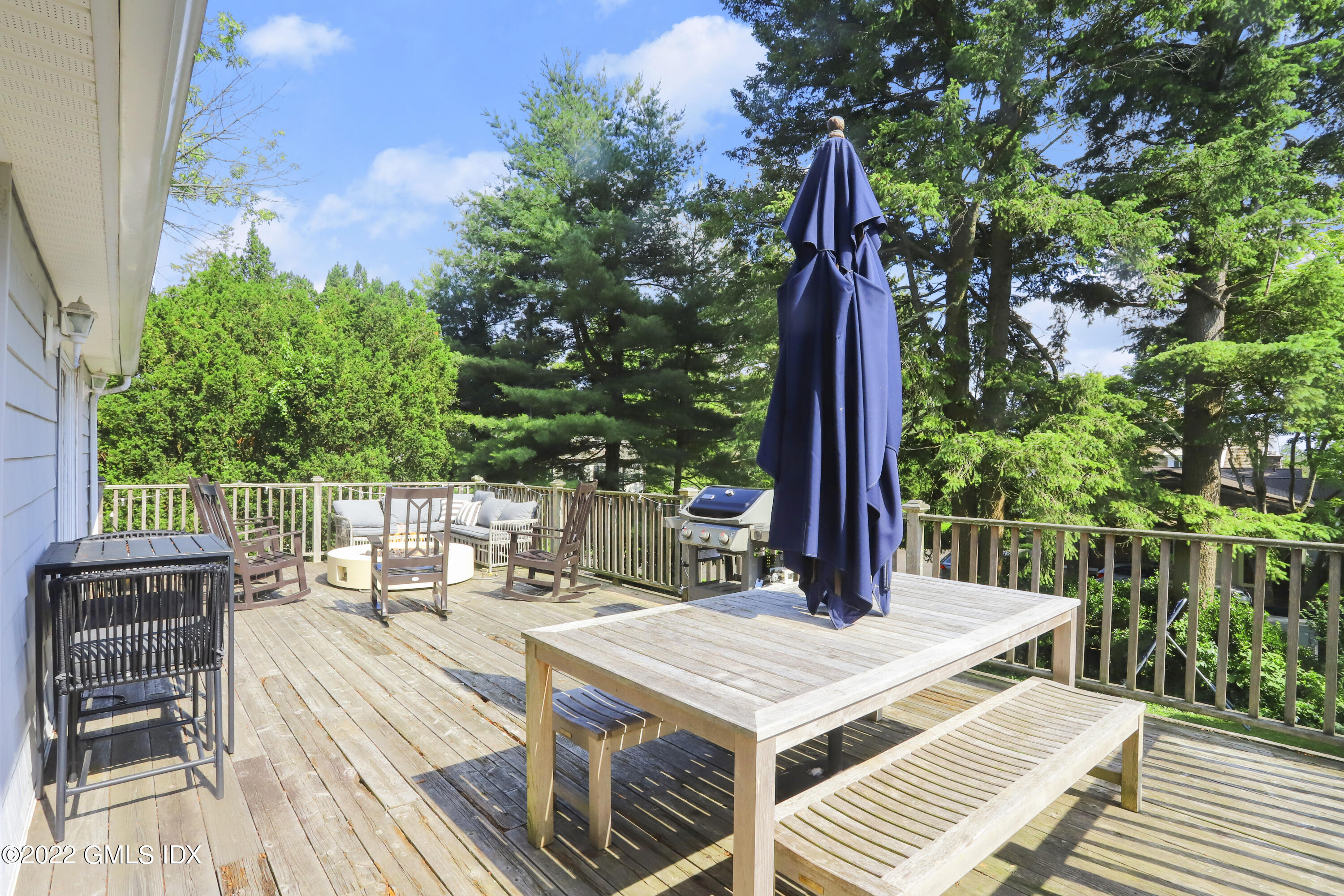 316 Riverside Avenue Riverside, CT 06878 - Photo 3 of 11 a view of balcony with wooden floor and outdoor seating
