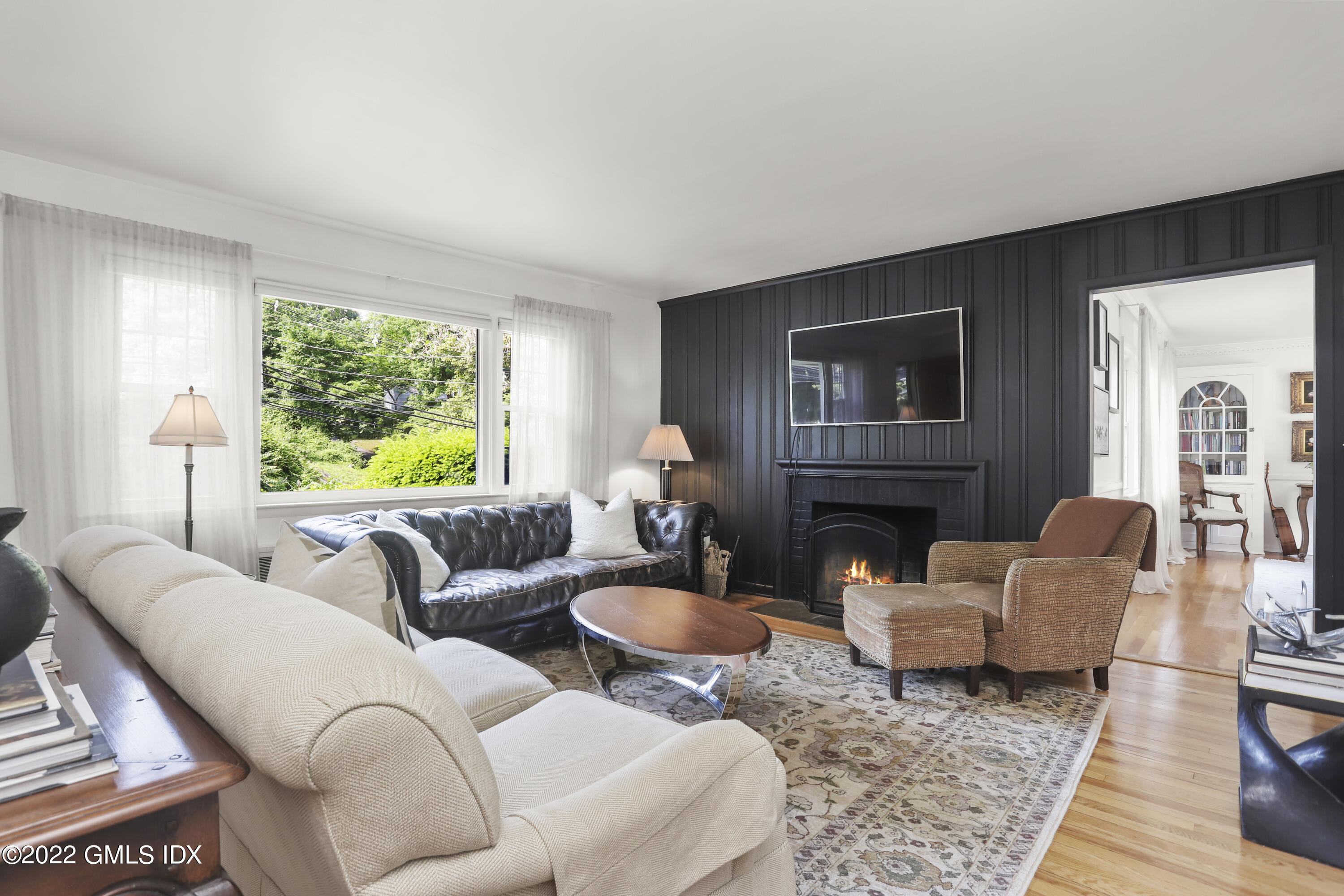 316 Riverside Avenue Riverside, CT 06878 - Photo 4 of 11 a living room with furniture a fireplace and a window