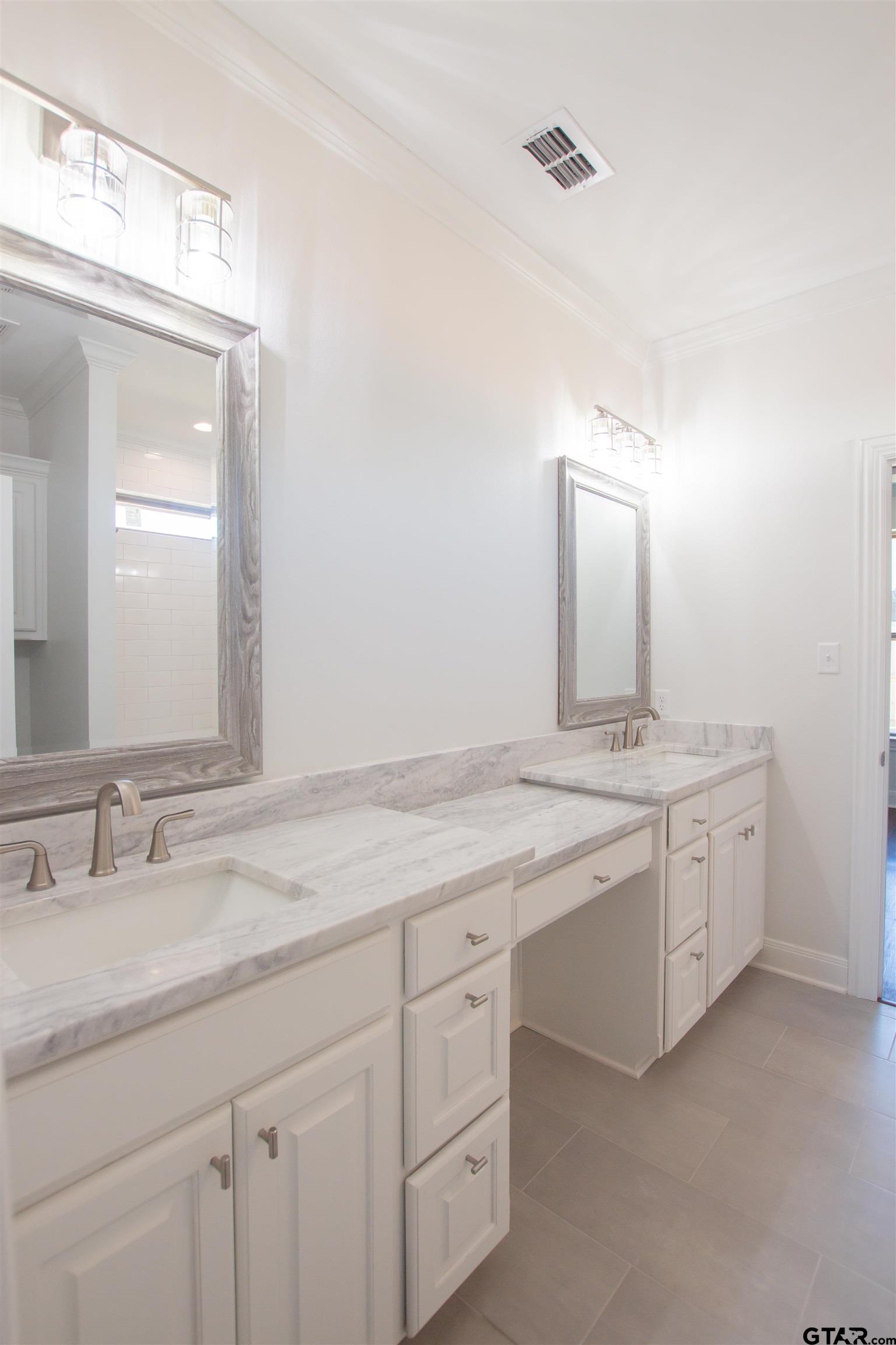 14716 Fallow Lane Tyler, TX 75706 - Photo 16 of 46 a bathroom with a granite countertop sink double and mirror