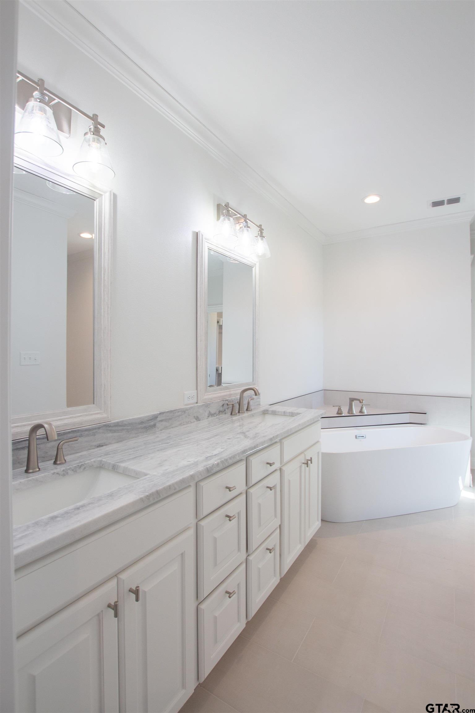 14716 Fallow Lane Tyler, TX 75706 - Photo 17 of 46 a bathroom with a granite countertop sink and a mirror