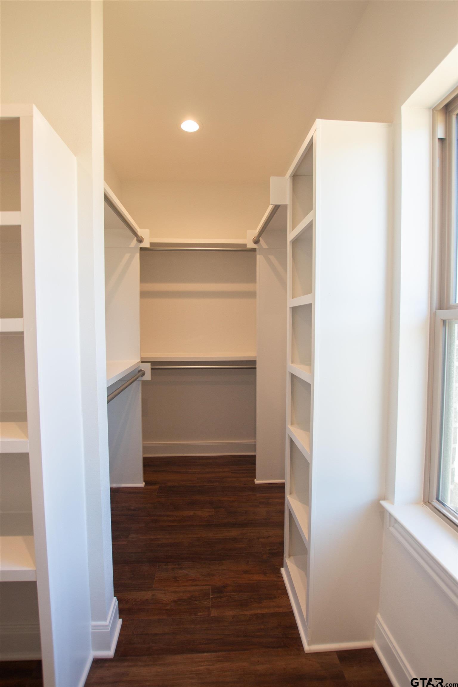 14716 Fallow Lane Tyler, TX 75706 - Photo 21 of 46 a view of walk in closet with wooden floor