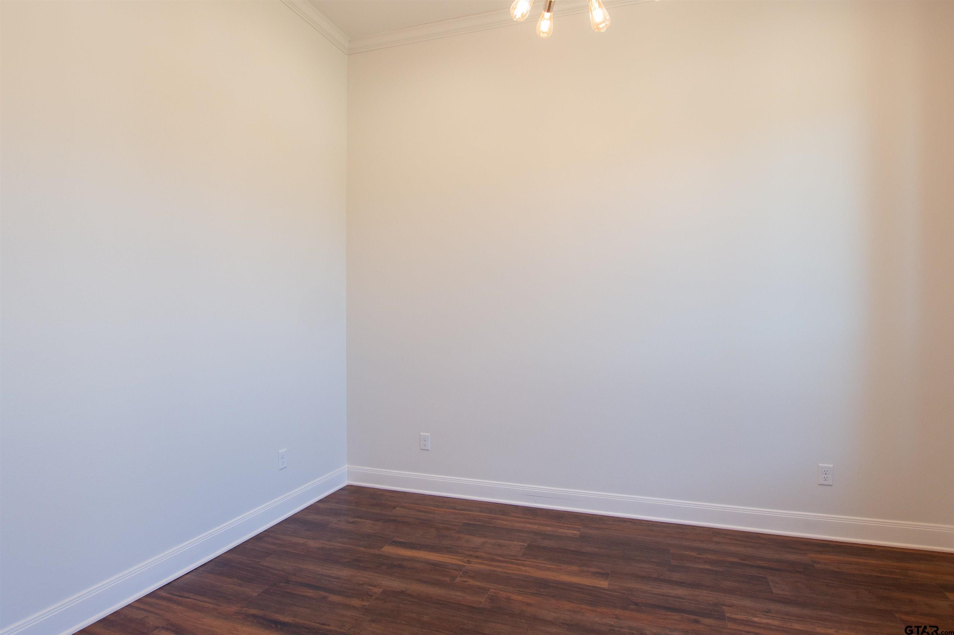 14716 Fallow Lane Tyler, TX 75706 - Photo 23 of 46 a view of an empty room with wooden floor
