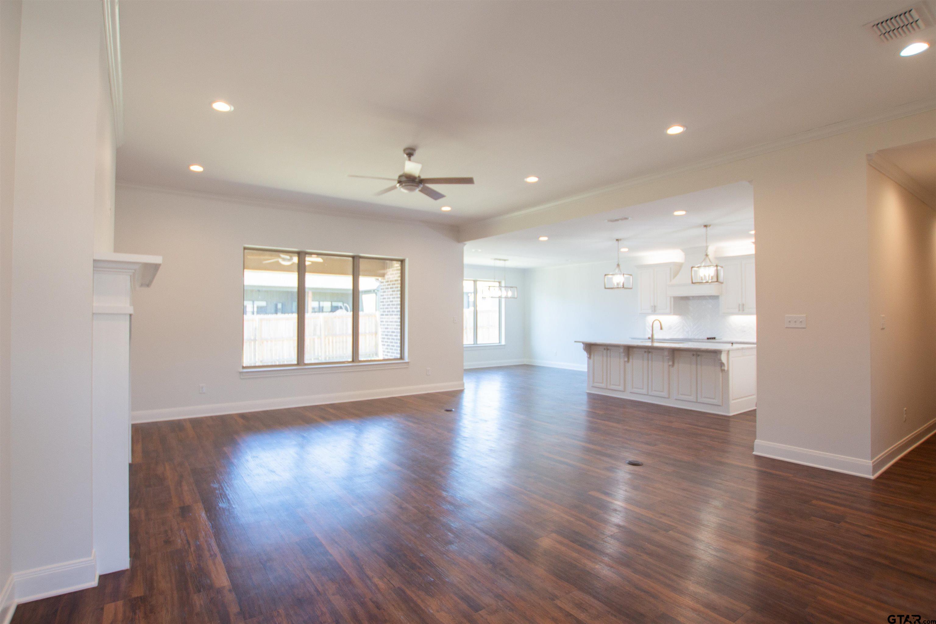 14716 Fallow Lane Tyler, TX 75706 - Photo 3 of 46 a view of an empty room with wooden floor and a window