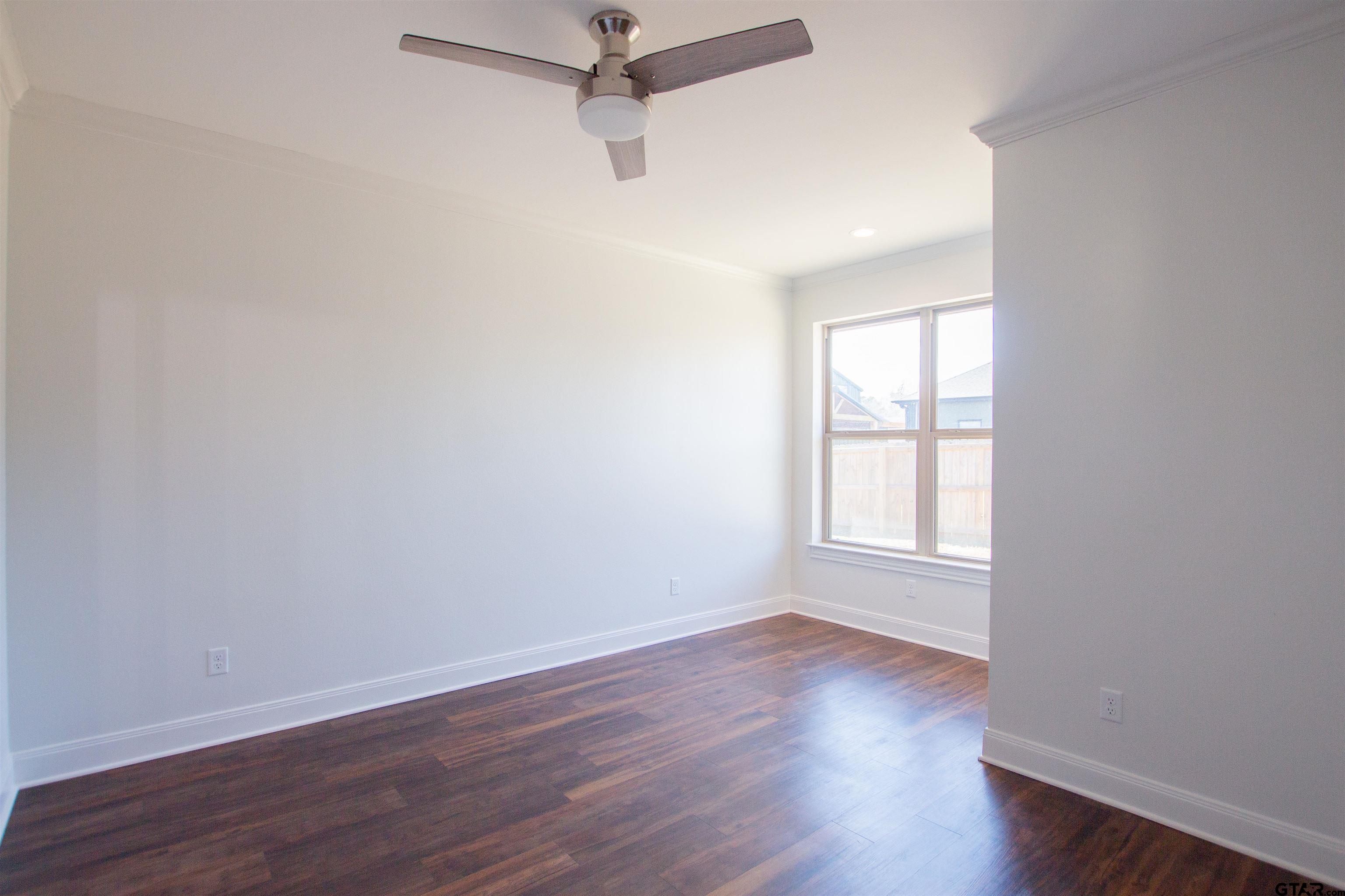 14716 Fallow Lane Tyler, TX 75706 - Photo 31 of 46 wooden floor in an empty room with a window