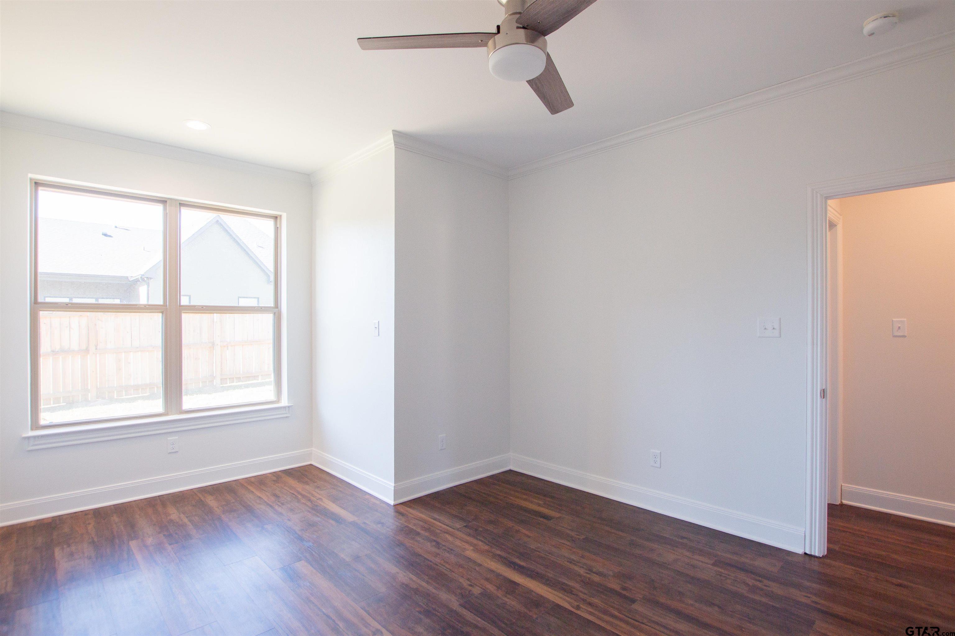 14716 Fallow Lane Tyler, TX 75706 - Photo 32 of 46 wooden floor in an empty room with a window