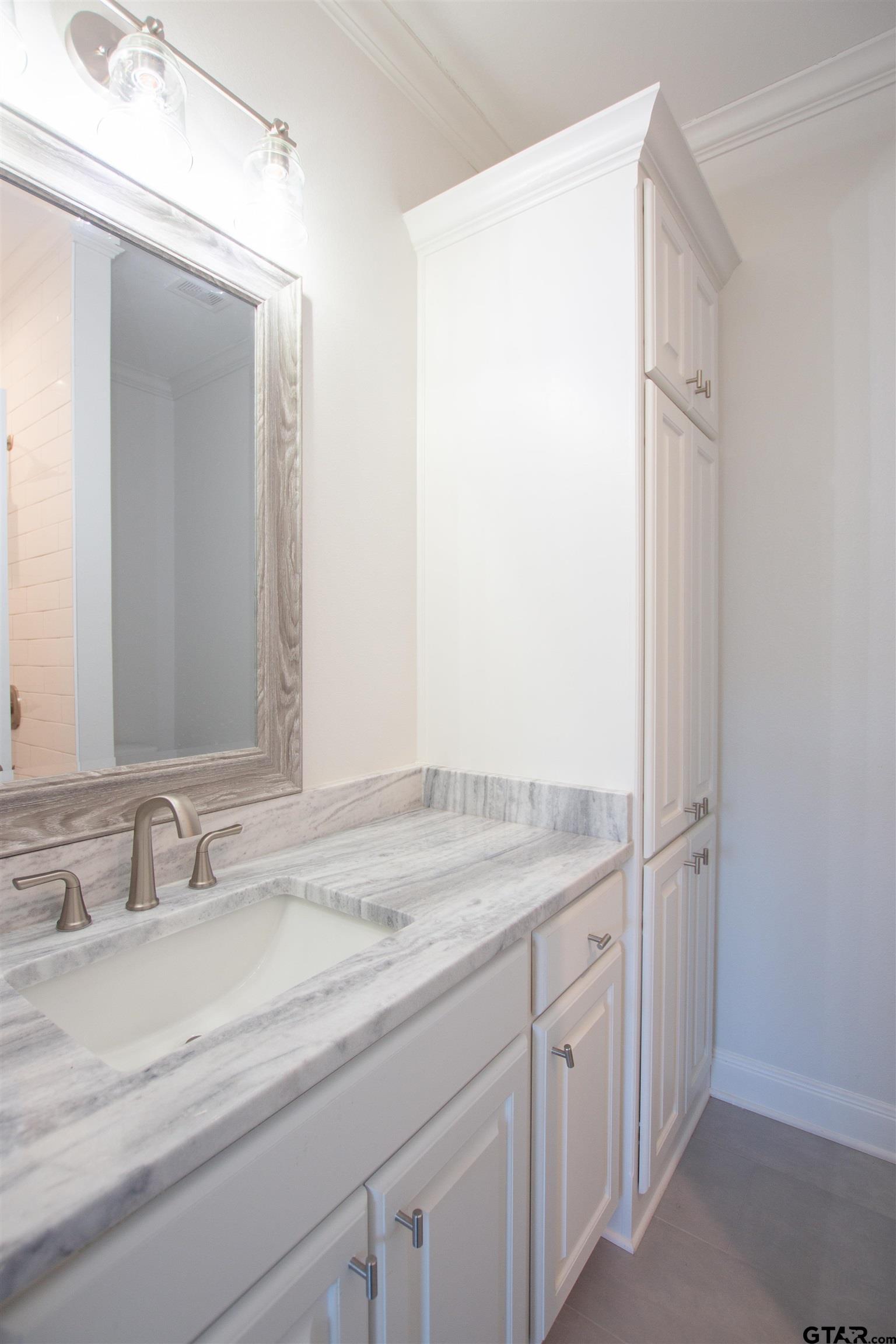 14716 Fallow Lane Tyler, TX 75706 - Photo 34 of 46 a bathroom with a granite countertop sink and a mirror