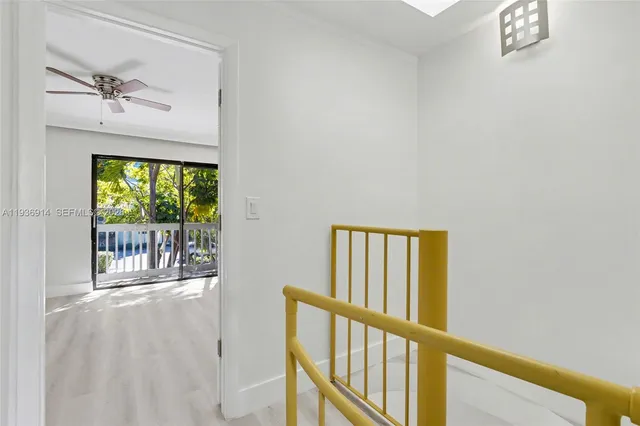 an aerial view of a residential houses with outdoor space and lake view