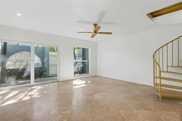 a view of kitchen with stainless steel appliances granite countertop refrigerator sink and stove top oven