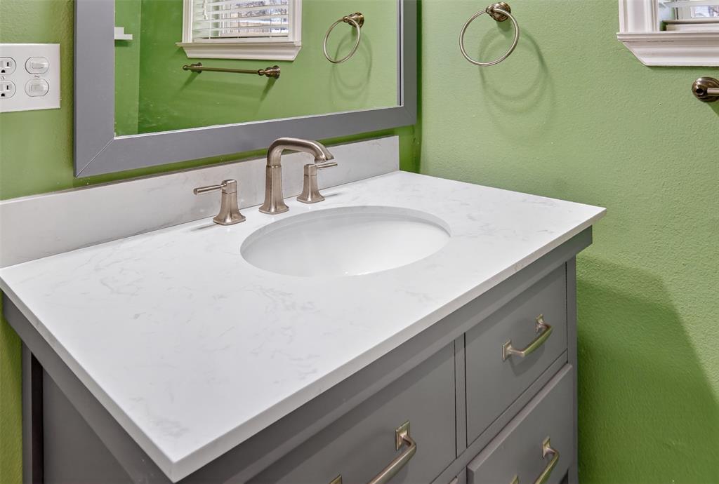 190 County Road 1975 Yantis, TX 75497 - Photo 19 of 36 a close view of a sink and a mirror in a room