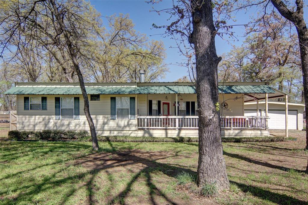 190 County Road 1975 Yantis, TX 75497 - Photo 4 of 36 front view of a house with a yard