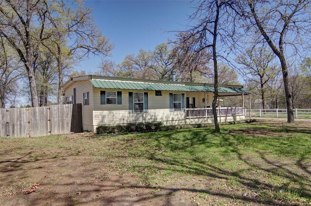 190 County Road 1975 Yantis, TX 75497 - Photo 5 of 36 front view of a house with a yard