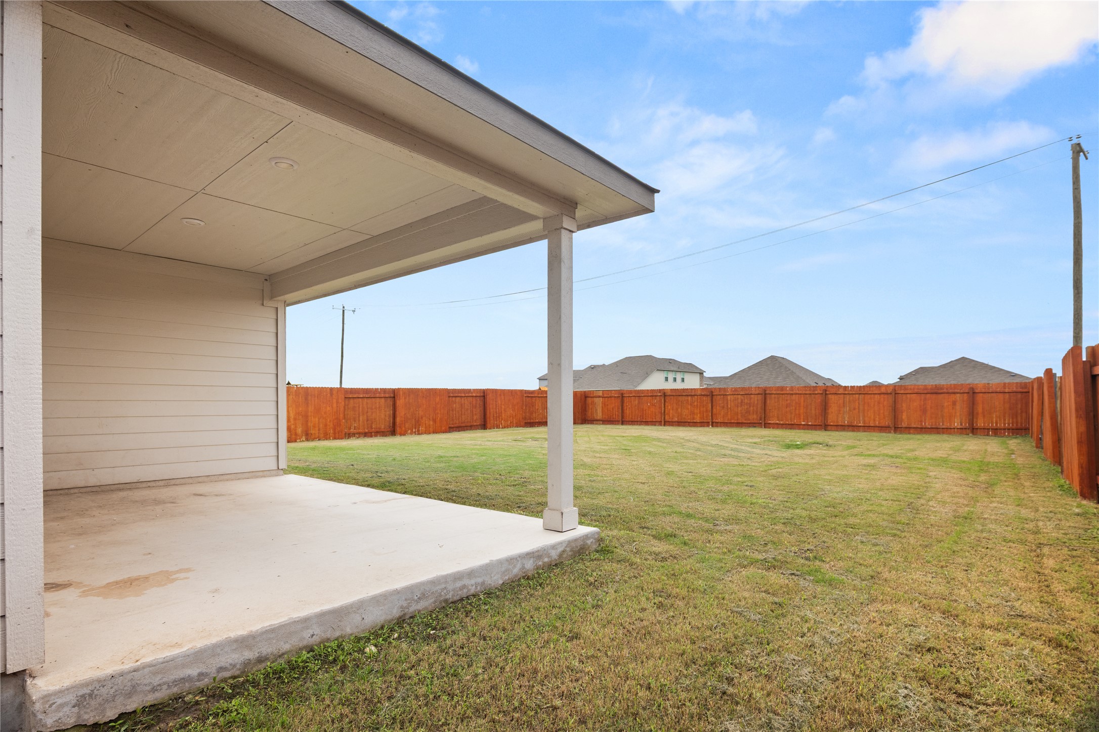 105 Saviano Road Hutto, TX 78634 - Photo 16 of 22 A spacious backyard with a private fence, perfect for entertaining or relaxation.