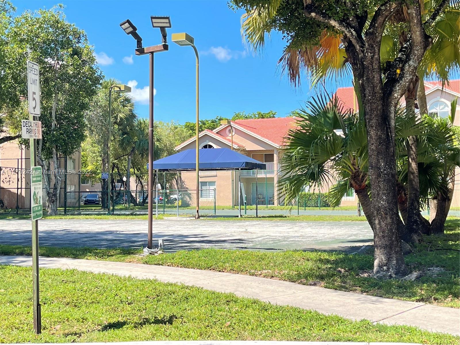 The Hammocks Miami, FL 33196 - Photo 16 of 21 a front view of a house with a yard