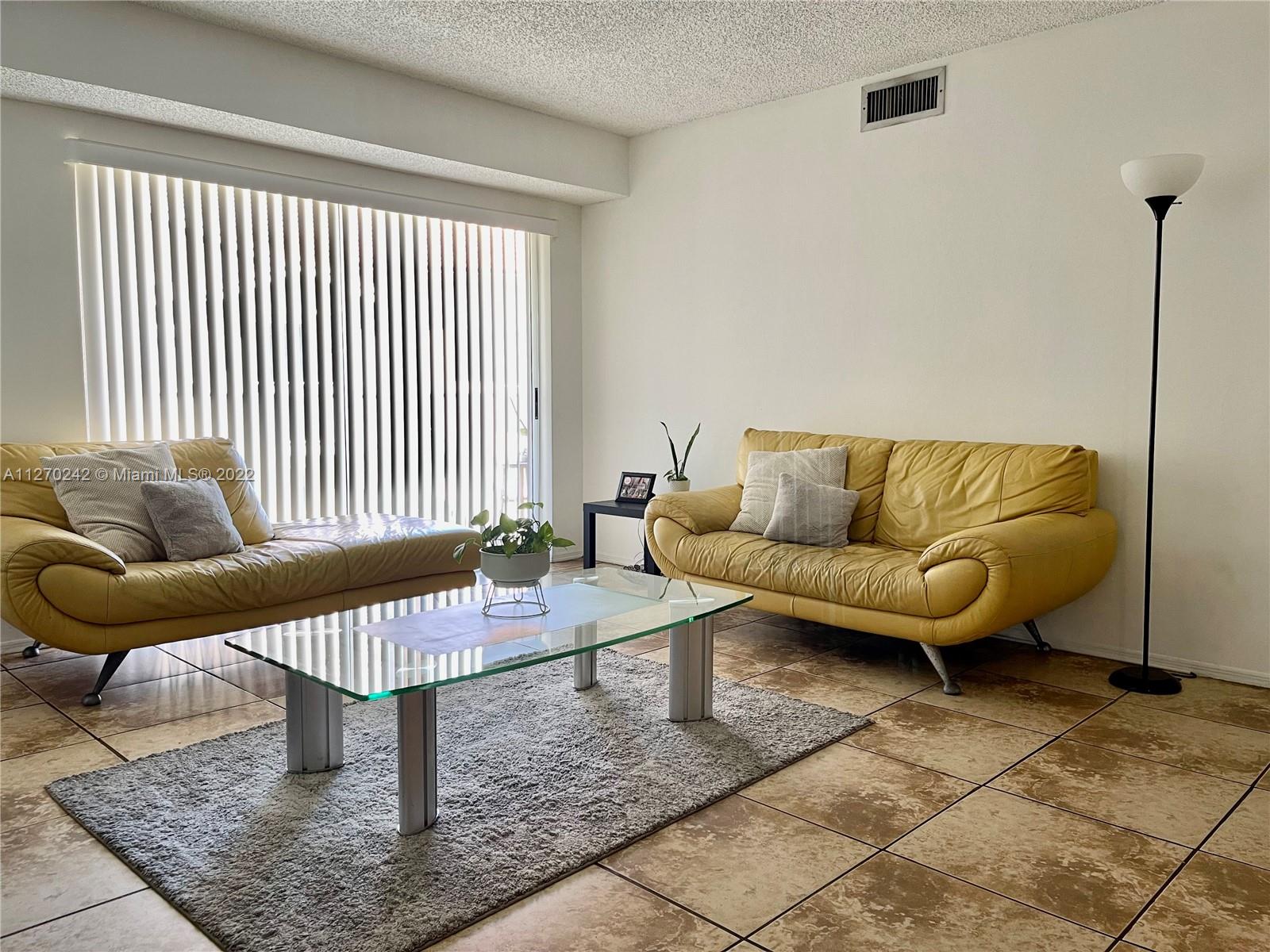 The Hammocks Miami, FL 33196 - Photo 4 of 21 a living room with furniture and a rug