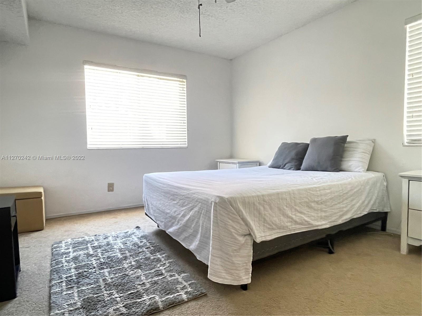 The Hammocks Miami, FL 33196 - Photo 8 of 21 a bedroom with a bed and a window