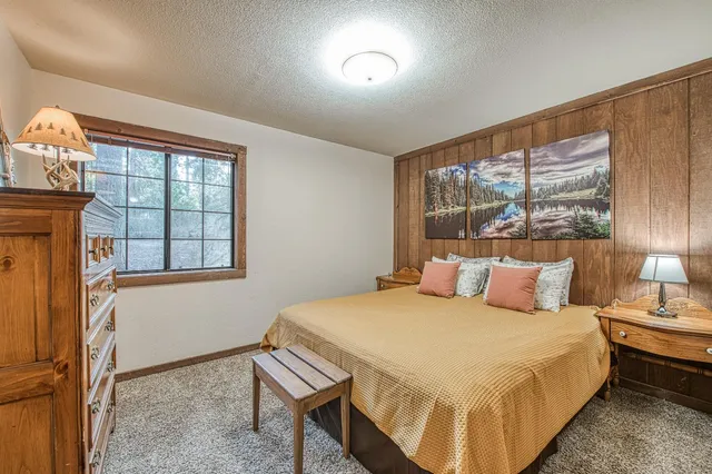 a room with painting on wall and a table