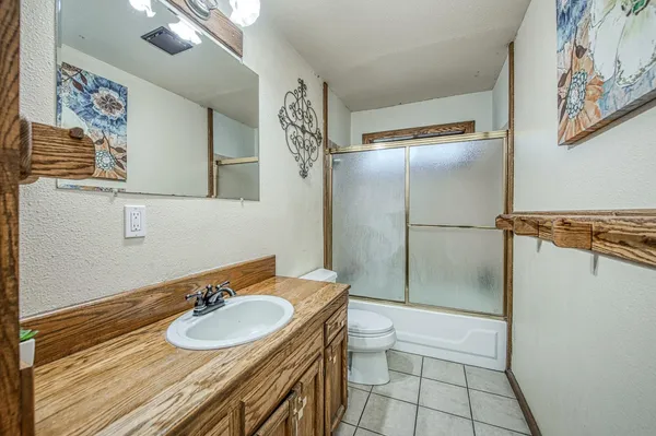 a kitchen with stainless steel appliances granite countertop a sink and stove