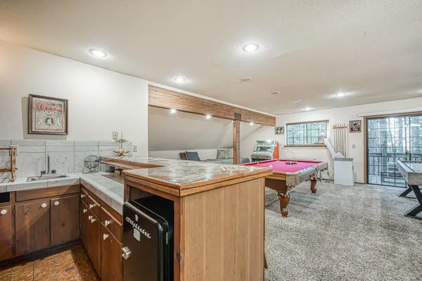 a kitchen with a table and chairs