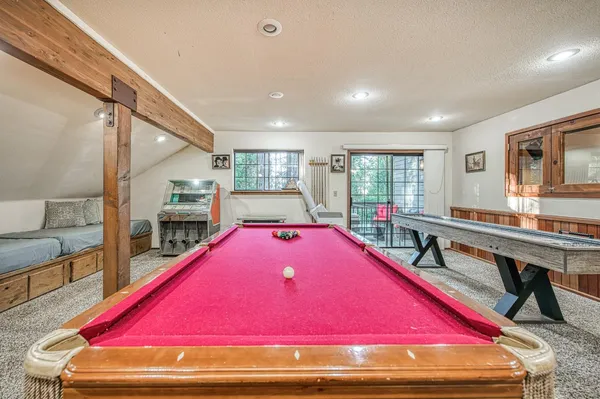 a room with furniture and pool table