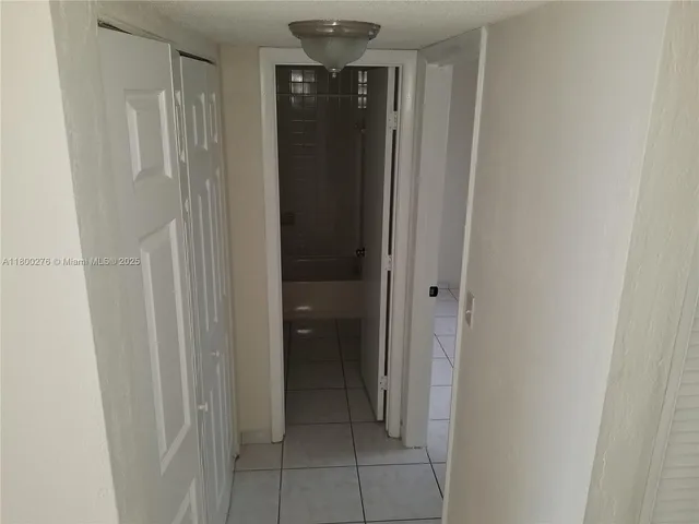 a bathroom with a sink and shower
