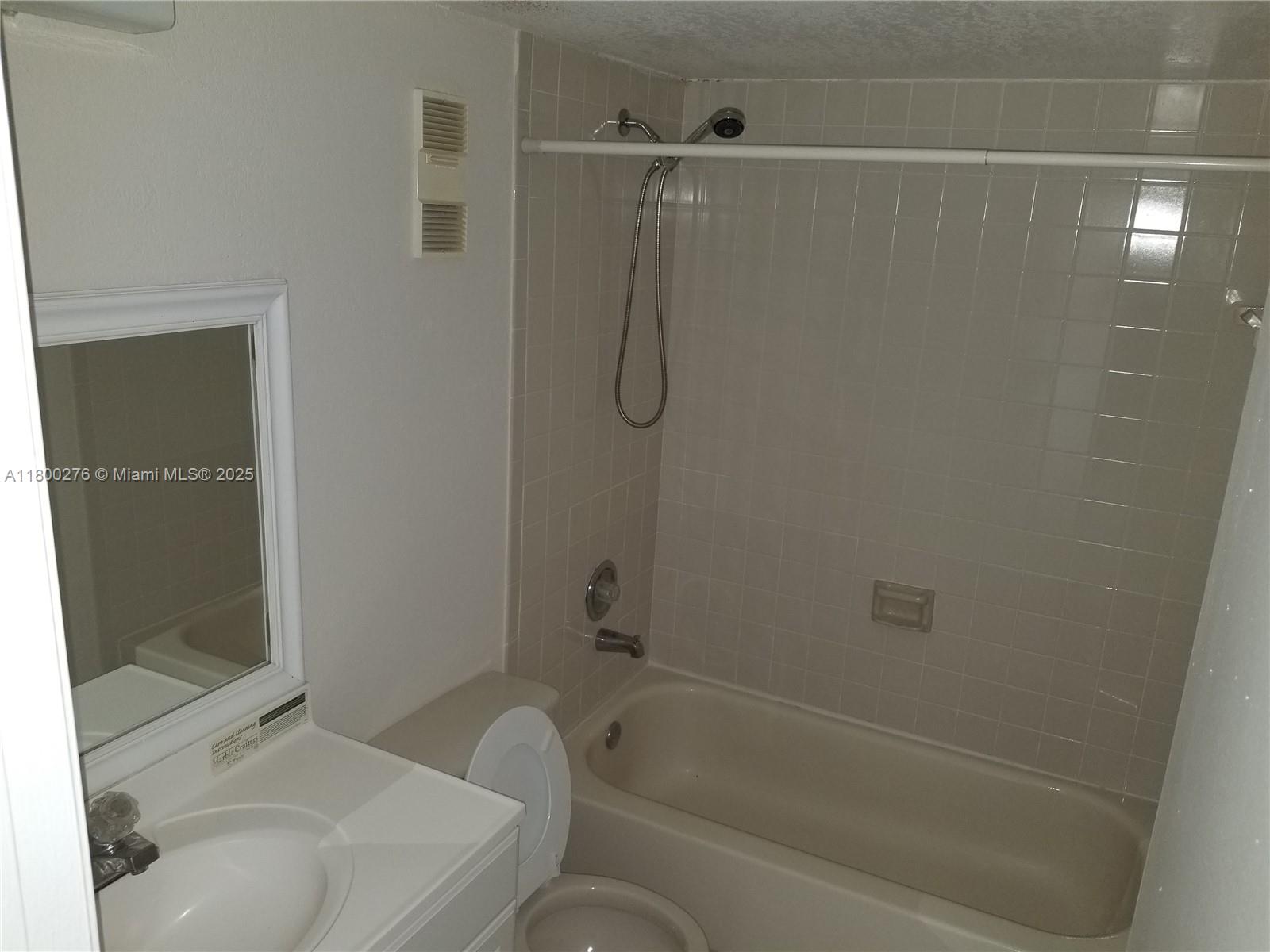 8560 Sherman Circle North, Unit 402 Miramar, FL 33025 - Photo 14 of 19 a bathroom with a sink and shower