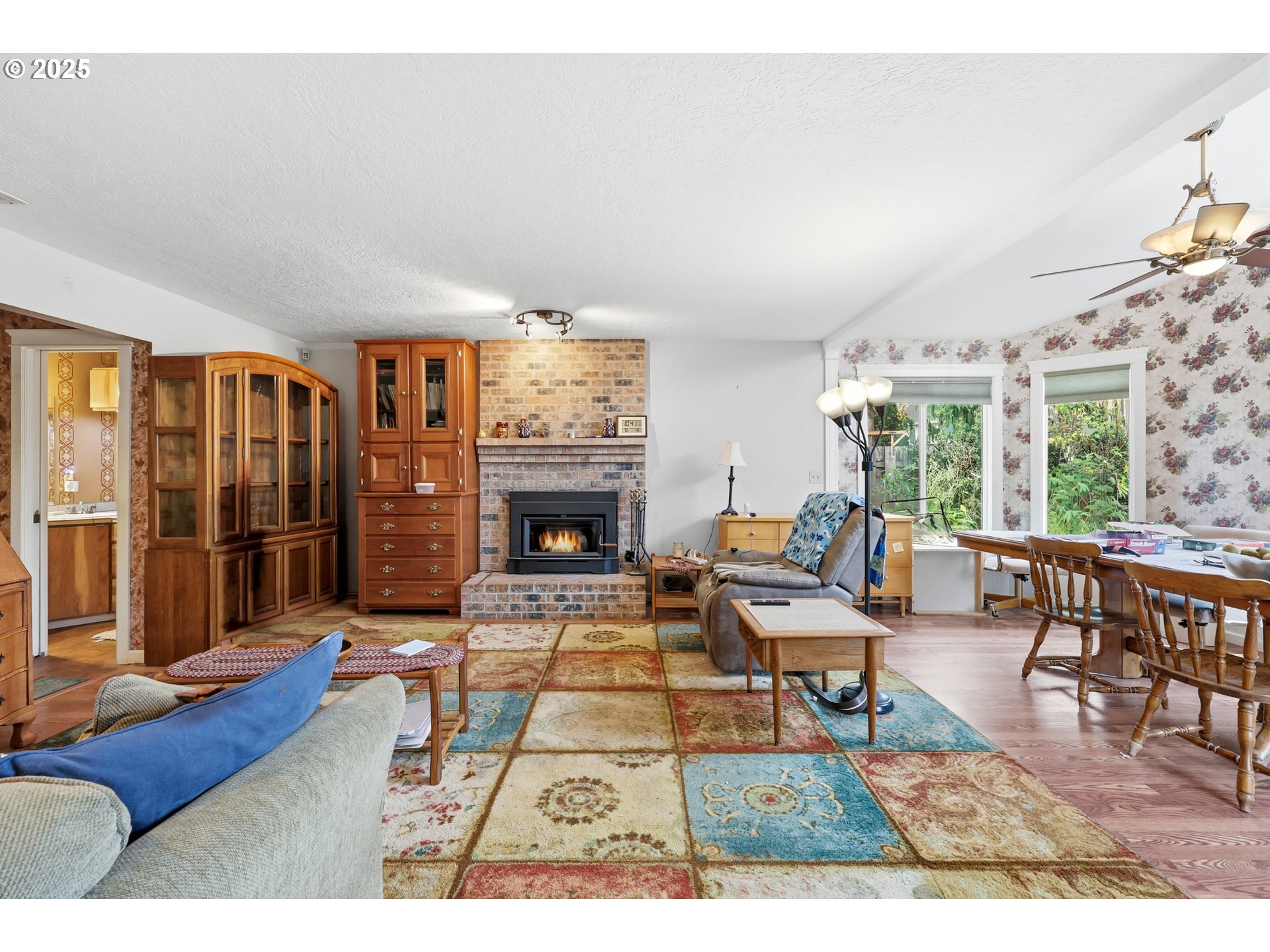 3749 Southwest 6th Street Gresham, OR 97030 - Photo 16 of 41 a living room with furniture and a fireplace