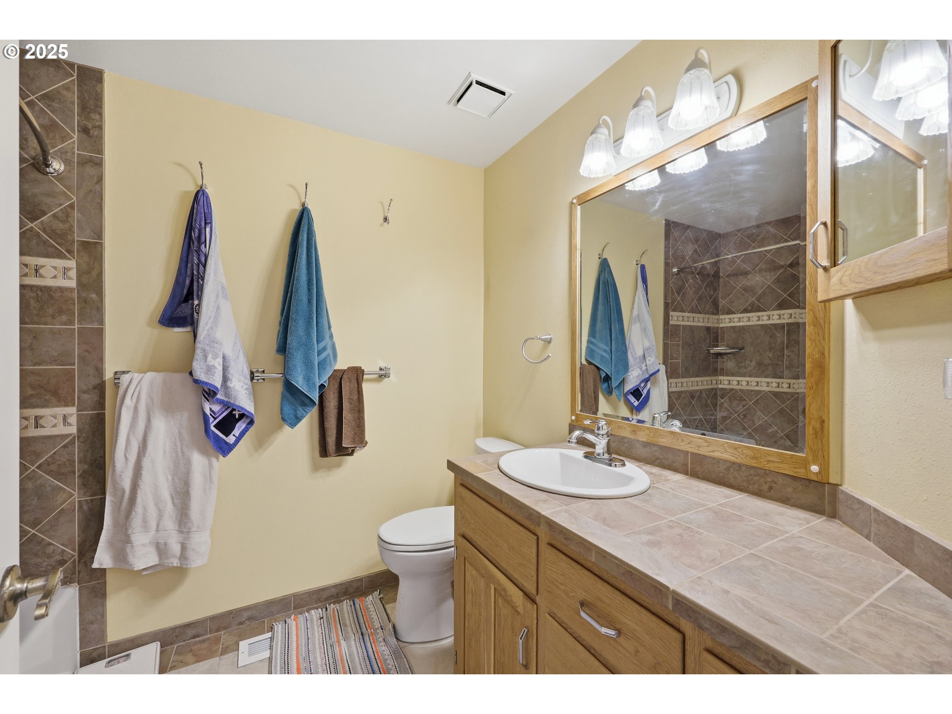 3749 Southwest 6th Street Gresham, OR 97030 - Photo 33 of 41 a bathroom with a sink vanity and a mirror
