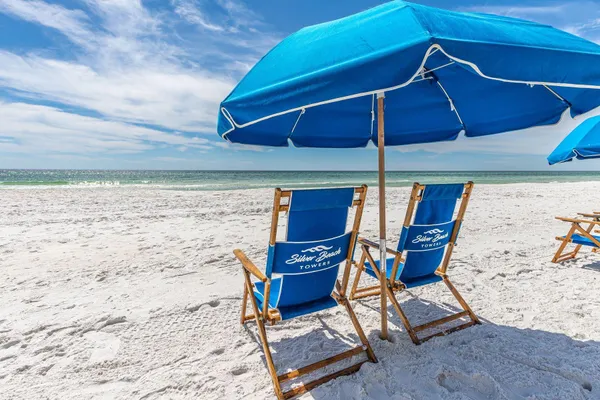 a view of a patio with table and chairs